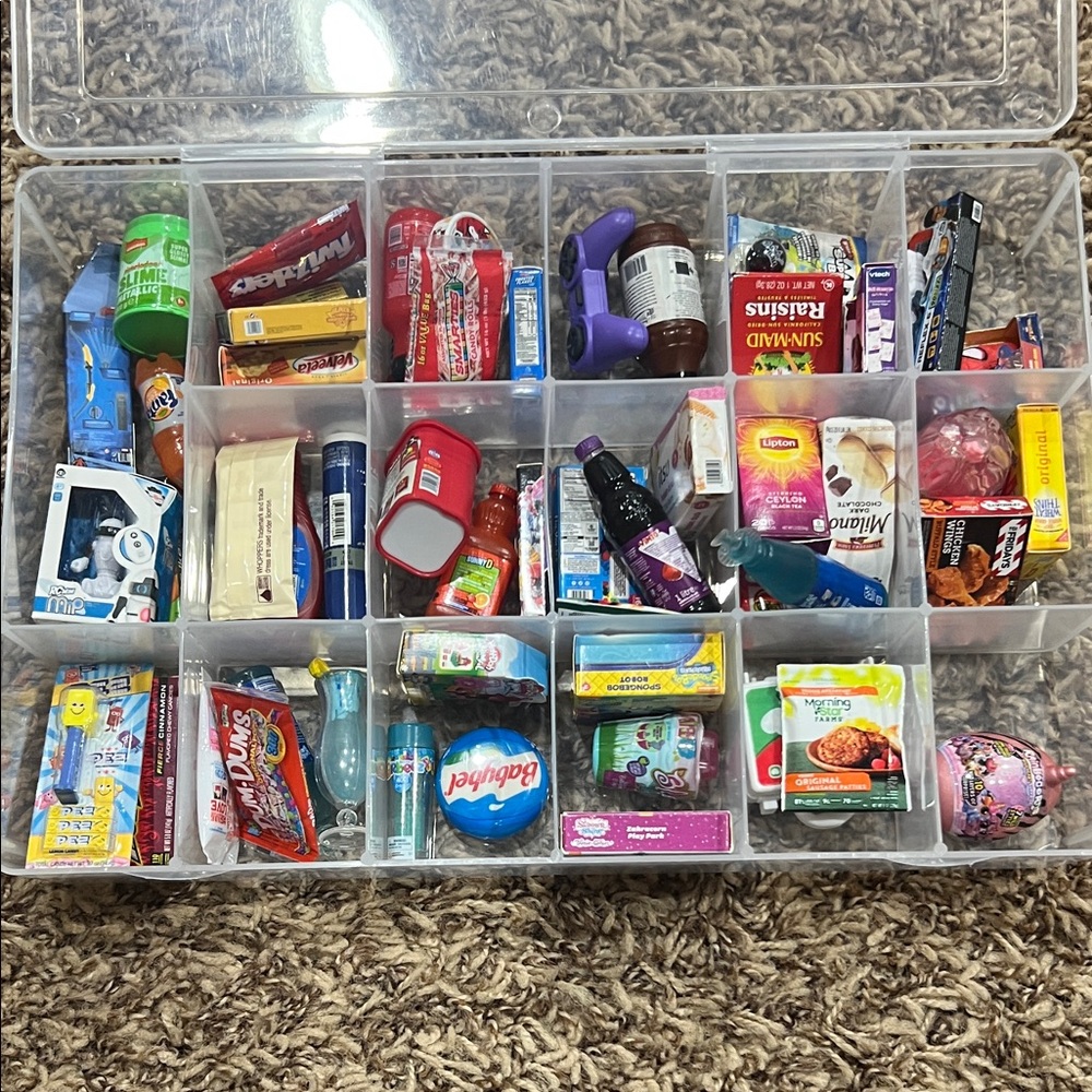 Collection of various mini brands in container